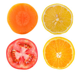slice lemon,orange,tomato and carrot on white