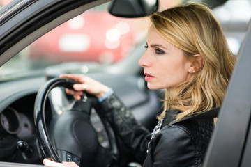 Fototapeta na wymiar Woman driving her car