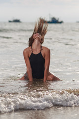 Beautiful young woman relaxing on the beach