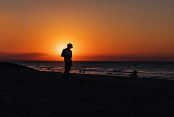 Silhouette Man in hat in sunset beach in Varadero, Cuba