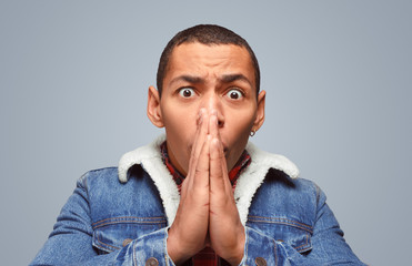 Stressed man praying for the best