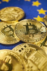 Bitcoin coins against the background of the European Union flag