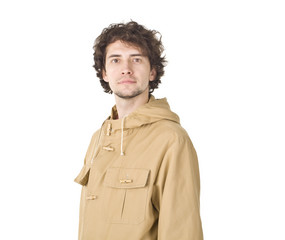 Amused man posing in raincoat