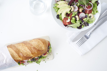 close up of fresh sandwich on plate of wood
