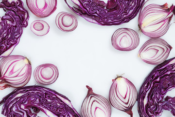Fototapeta premium Sliced red onion and cabbage on a white background