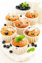 Oat muffins with blueberries on a dark background.