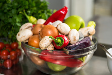 Fresh spring vegetables and fruit with spicecs. Restaurant food preparation