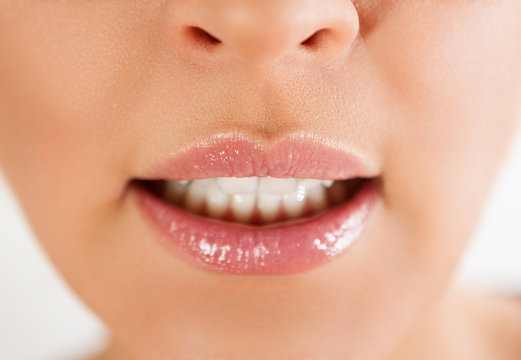 Woman lips with open mouth and white teeth