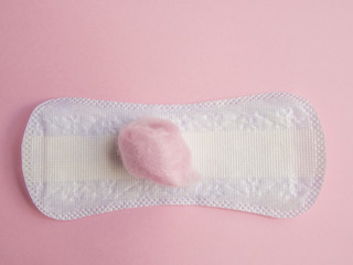 Panty liner on pink background with pink cotton