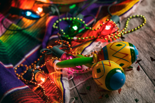 Fiesta: Colorful Maracas Amongst Cinco Beads And Lights