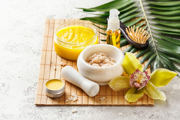 Spa composition with massage oil and various cosmetic. Selective focus.