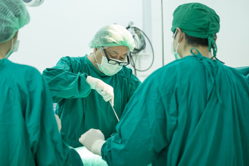 The surgery team working together at the operating room in the hospital.