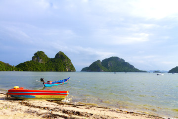 Fototapeta na wymiar Beach Bang Boet and red small boat