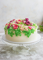 Birthday cake with flowers rose on white background