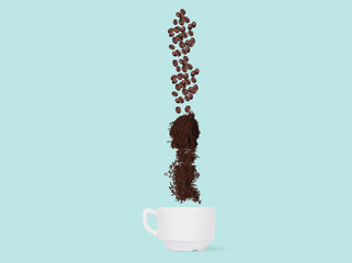 Coffee beans and ground coffee fall into the cup. Concept