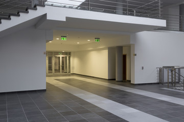 modern white office corridor with warm down lights