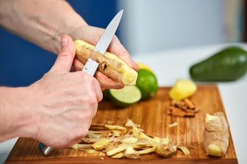 Man peeling ginger