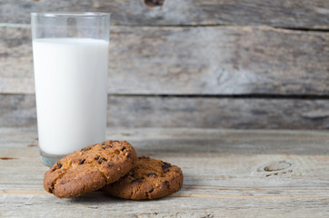 Glass of milk and cookies with chocolate chips.Village Breakfast.