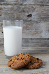 Glass of milk and cookies with chocolate chips.Village Breakfast.