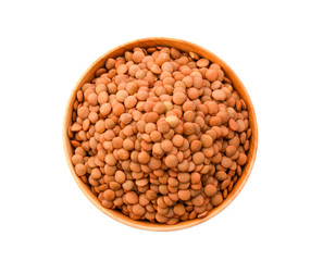 Brown Lentils in wood bowl isolated on white background