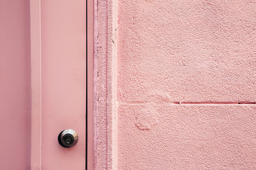 Pink wall and door closeup background