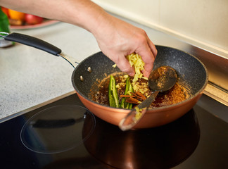 Man adding ingredients to recipe