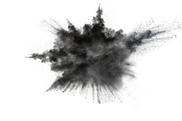 Black powder explosion against white background.The particles of charcoal splattered on white...