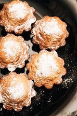 Delicious sweet cupcakes on black plate, delicious homemade dessert