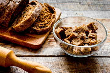 traditional bread with rolling-pin wooden table background
