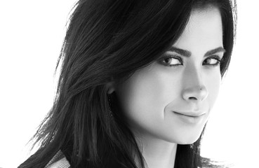 Fototapeta premium Black and white closeup portrait of a beautiful young woman in black. Sensual look