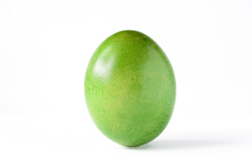 Close up of a green easter egg isolated on white.