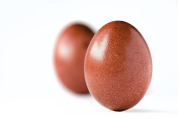Close up of a red easter egg isolated on white.