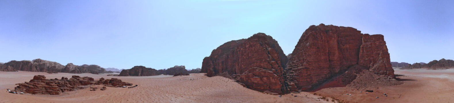 Composite panorama of high resolution aerial photos of a monolithic mountain in the central area of the desert reserve of Wadi Rum, Jordan