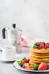 Stack of homemade pancakes for breakfast with berries