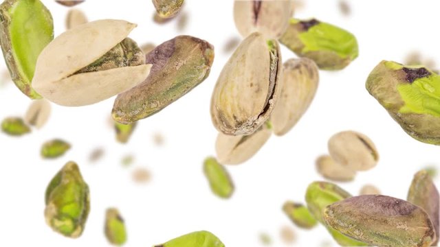Pistachios (whole and kernels) falling down on white background (45 degrees, seamless loopable)