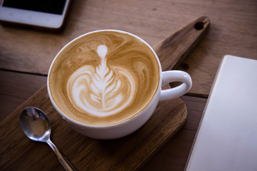 coffee aroma latte art cup on wood table relaxtime in cafe coffee shop