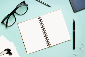 A notebook and glasses.