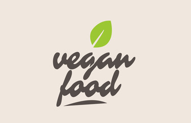 vegan food word or text with green leaf. Handwritten lettering