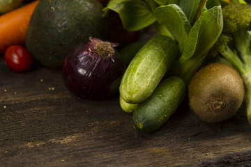 Vegetables on wood. Healthy food and fruits. Organic vegetables and fruits on wood