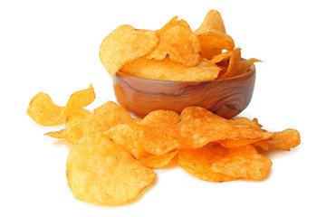 Delicious potato chips in a wooden bowl isolated on white background, including clipping path...