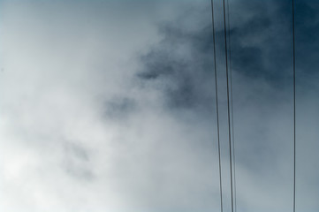Obraz premium Wires and the cloudy sky