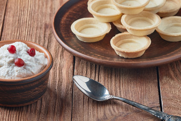 Freshly baked tartlets on a plate.