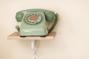 A green wired phone.
