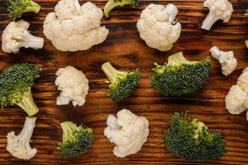cauliflower and broccoli on a rustic background