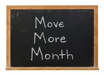 Move more month written in white chalk on a black chalkboard isolated on white