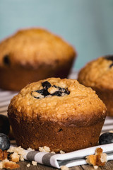 Delicious Blueberry Muffins with blue background.