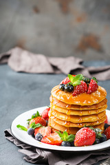 Stack of homemade pancakes for breakfast with berries