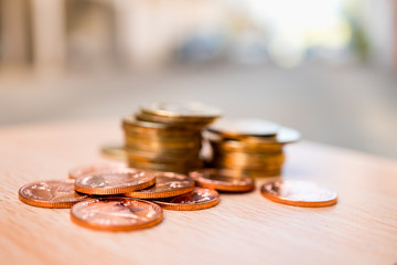 Closeup stack coins on blurred background using as business and financial concept