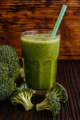 fresh broccoli juice on a wooden background