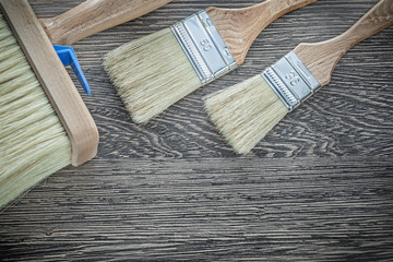 Set of paintbrushes on wooden board